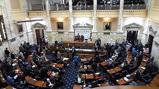 A large group of people in the middle of a room.