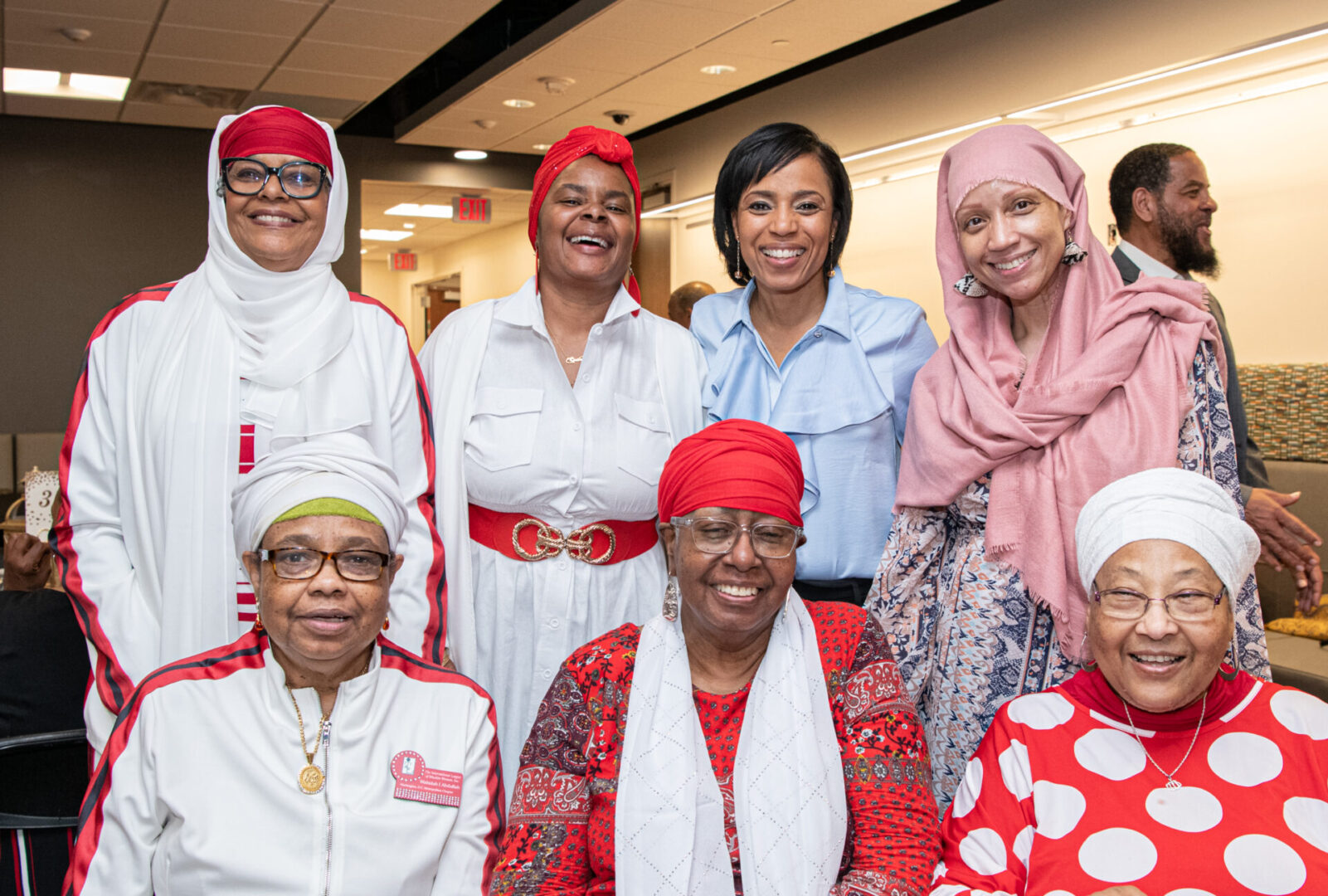 A group of women in red and white outfits.