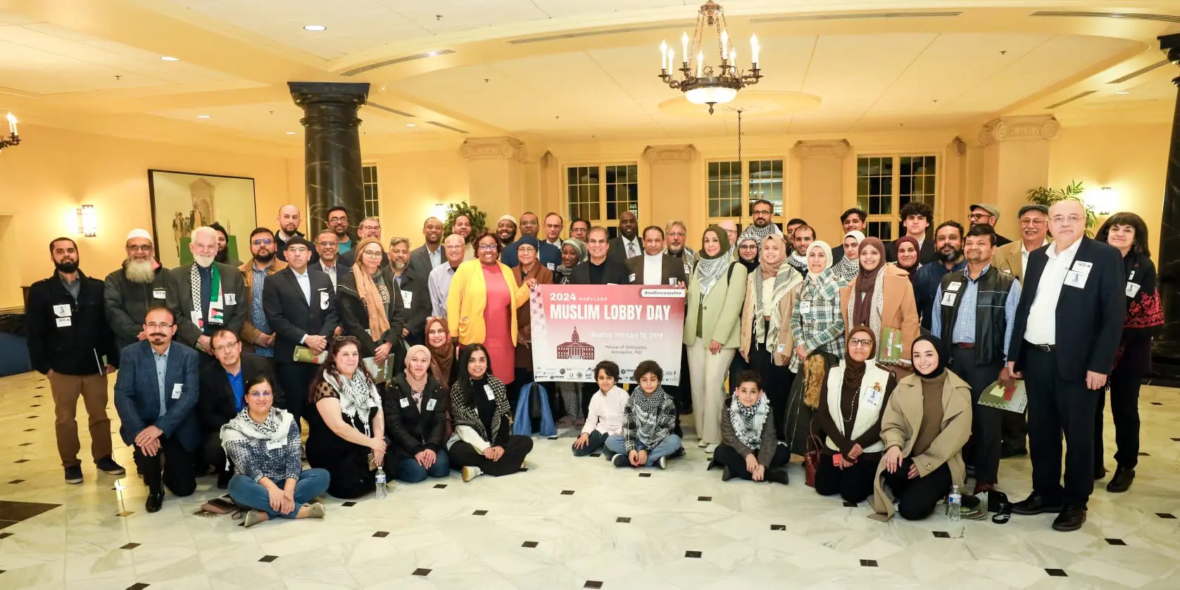 Group of individuals posing for a photo at the 2020 muslim lobby day event.